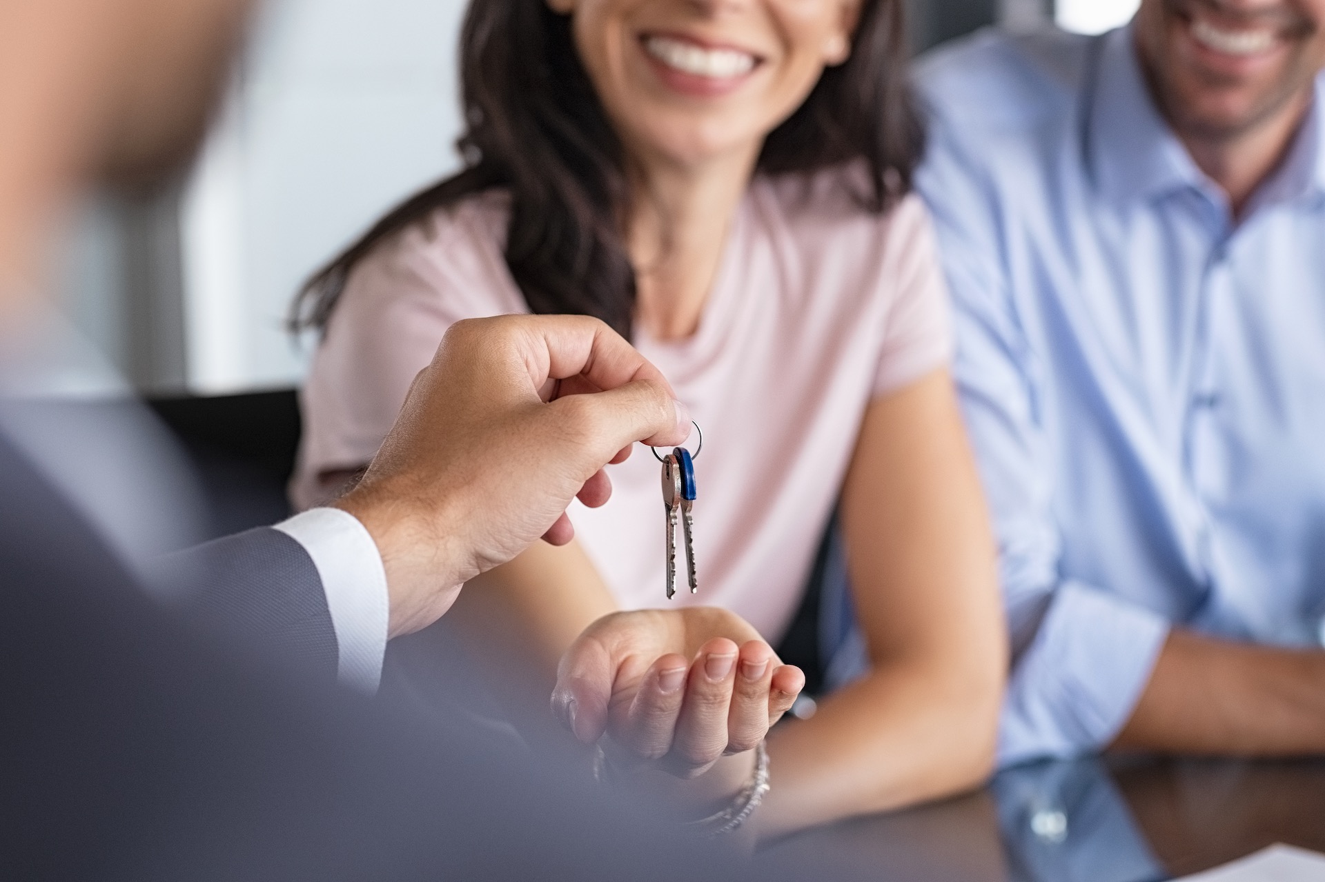 Image of real estate agent handing over keys